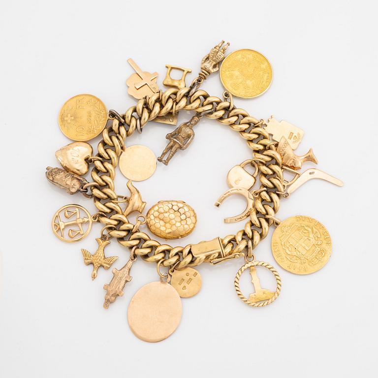 18K gold charm bracelet.