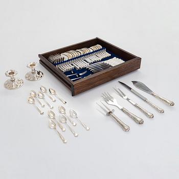 A 47-piece set of 'Chippendale' silver cutlery and a pair of silver candlesticks, Finnish marks 1983-2003 and 1976.