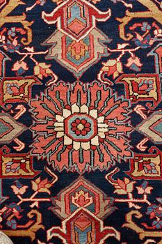 A carpet, an antique Heriz, ca 564,5 x 587,5 x 376,5-380 cm.