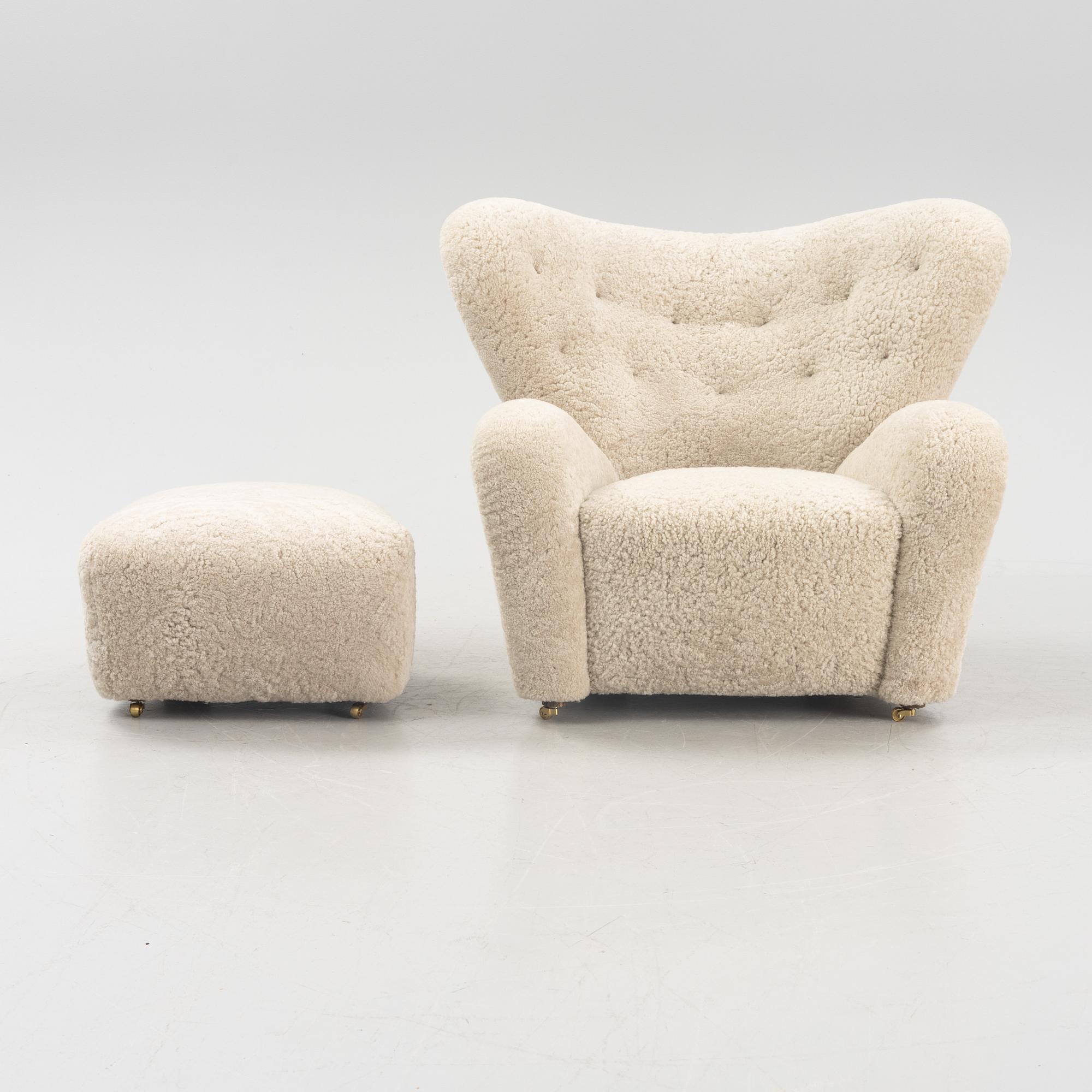 A 'The tired man' lounge chair with stool by Flemming Lassen by Lassen, designed 1935.