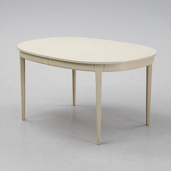 A dining table with six chairs by Carl Malmsten, second half of the 20th Century.