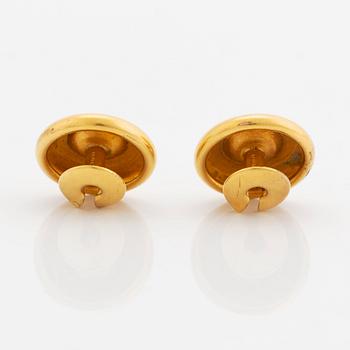 A pair of 18K gold cufflinks set with old-cut diamonds.