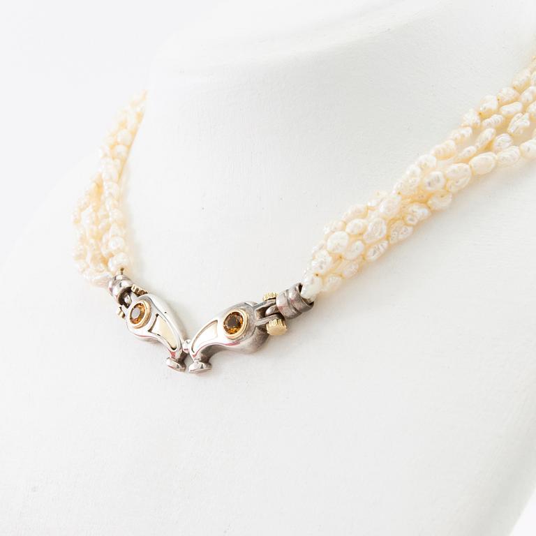 Tonino Lamborghini, Necklace of cultured pearls with a pendant of 18K gold, silver, and faceted citrines.