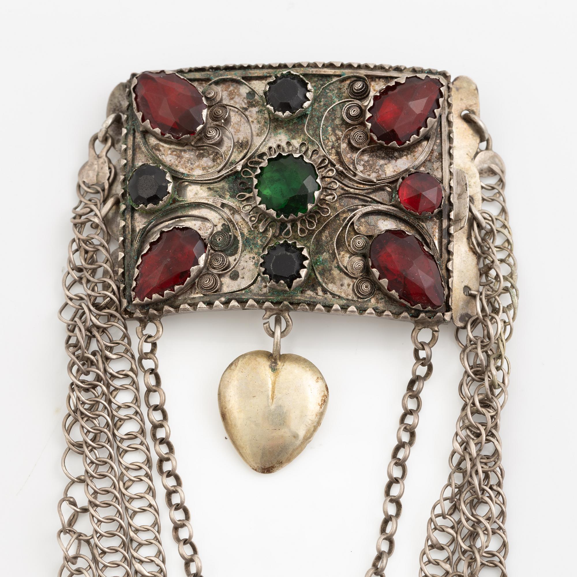 Folk costume jewellery, silver with glass stones.