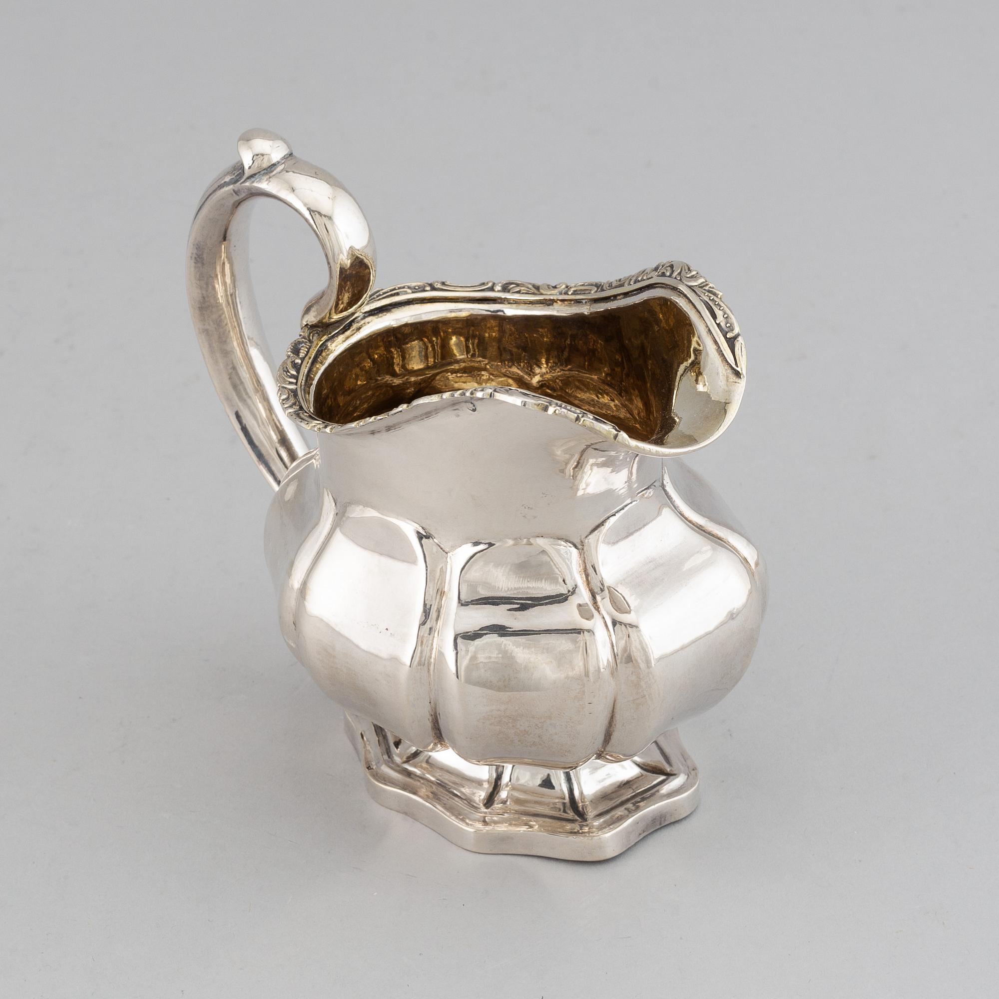 A Russian 19th century parcel-gilt silver cream-jug, mark of Abraham Forstedt, St. Petersburg 1840.