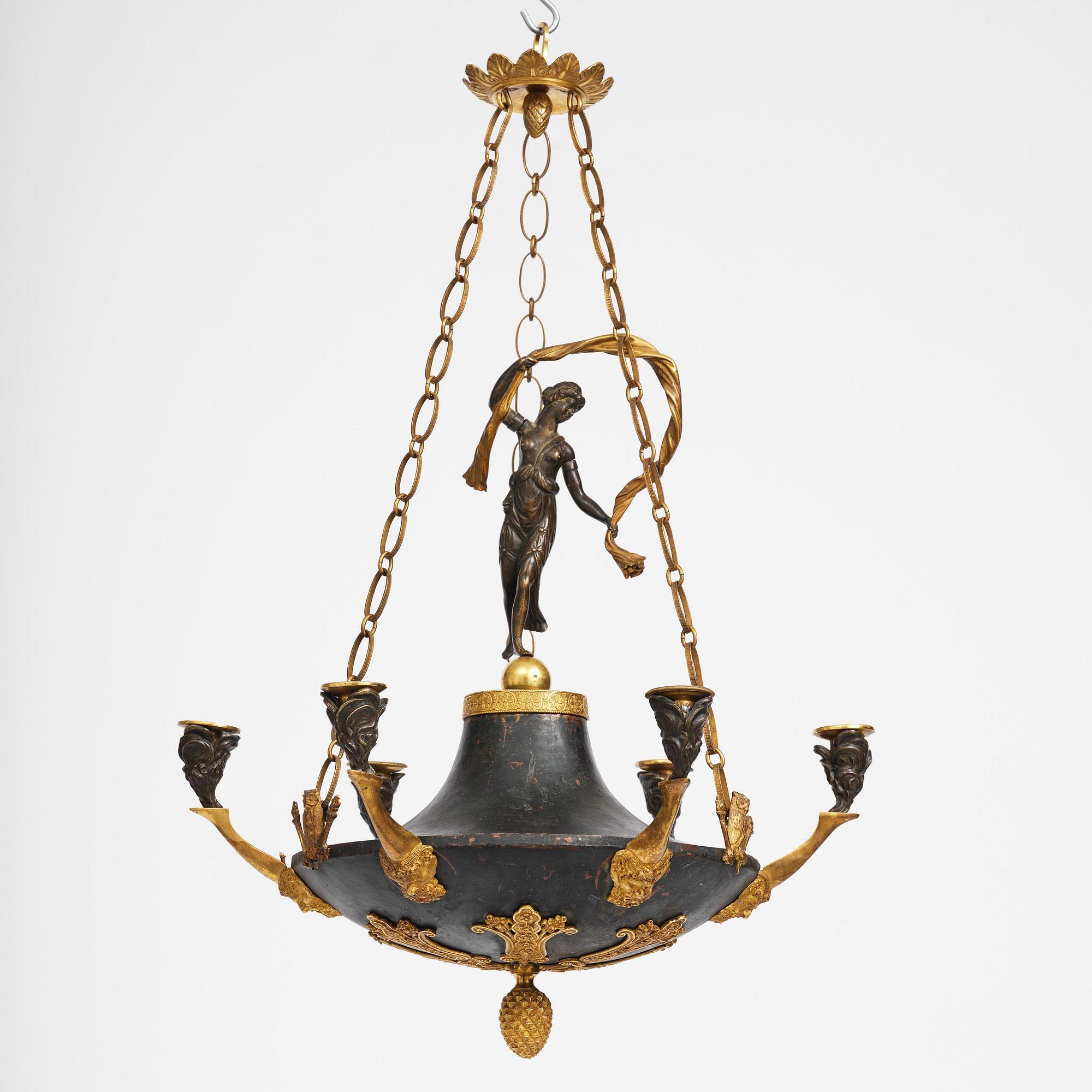 A patinated and ormolu six-light Empire chandelier, Stockholm, first part 19th century.