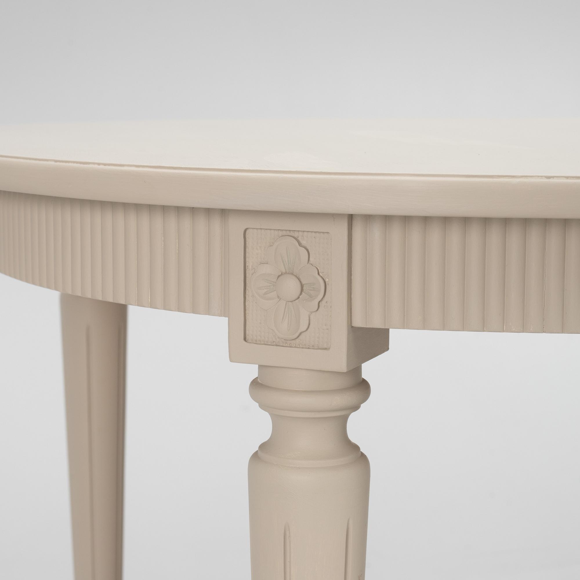 A Gustavian Style Dining Table and 10 Chairs, second half of the 20th Century.