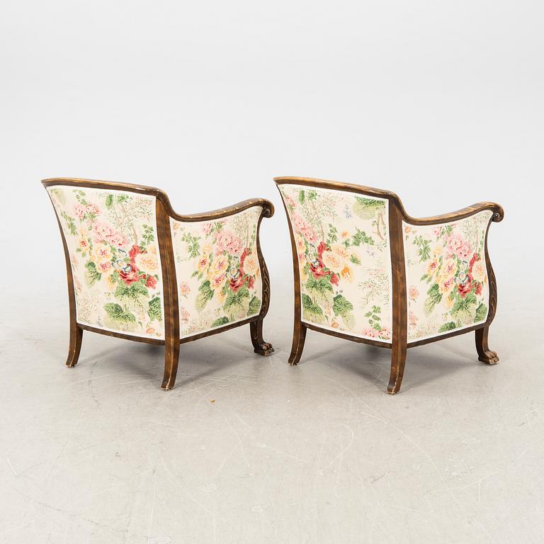 A pair of stained birch 1940s armchairs.