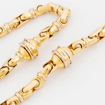 An 18K gold necklace/bracelet combination.