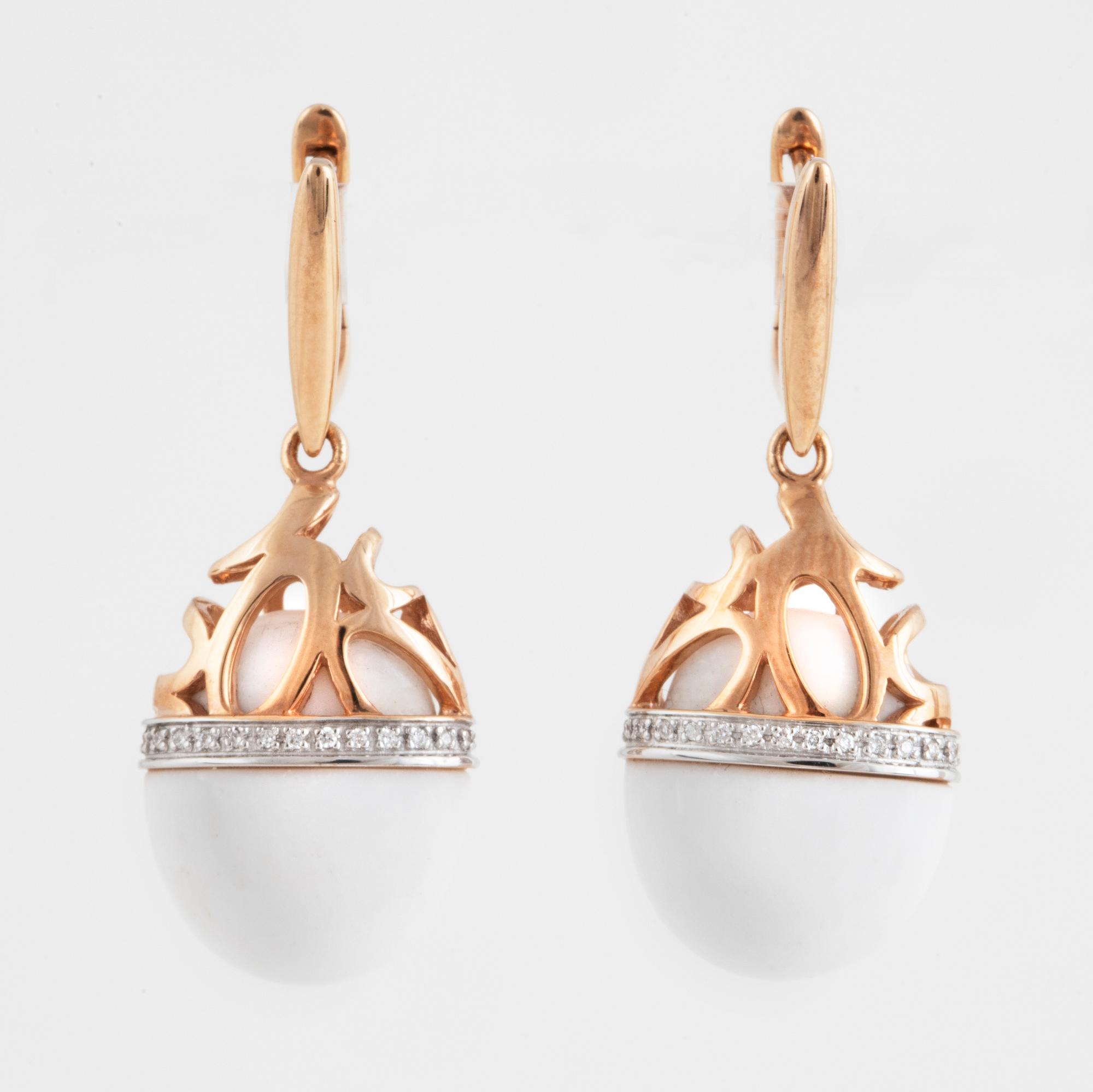A pair of brilliant cut diamond and white agate earrings.