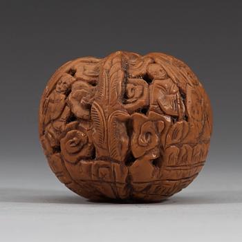 A set of six carved walnut hand exercisers, late Qing dynasty (1644-1912).