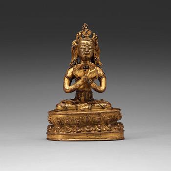 196. A gilt copper alloy figure of Vajradhara, possibly Tibet, 15/16th Century.