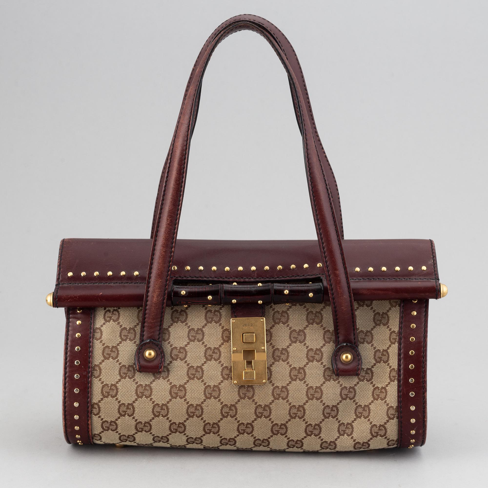 Gucci, a monogram canvas bag.