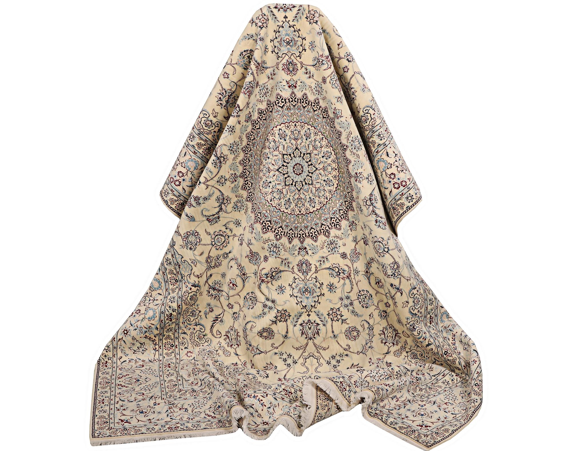 A Nain carpet, part silk, signed, 6 laa, c. 295 x 205 cm.