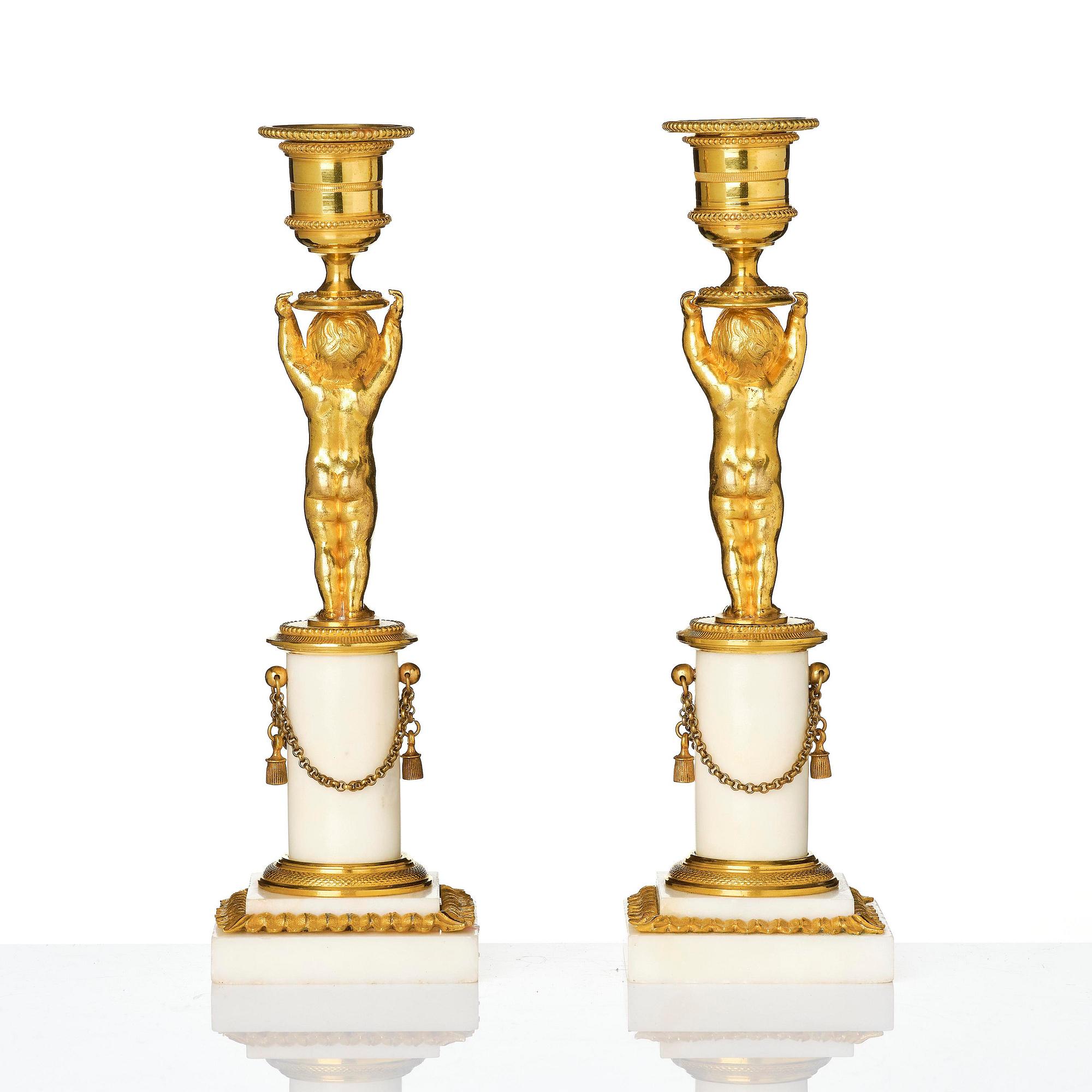 A pair of late Gustavian ormolu and white marble candlesticks, Stockholm, late 18th century.