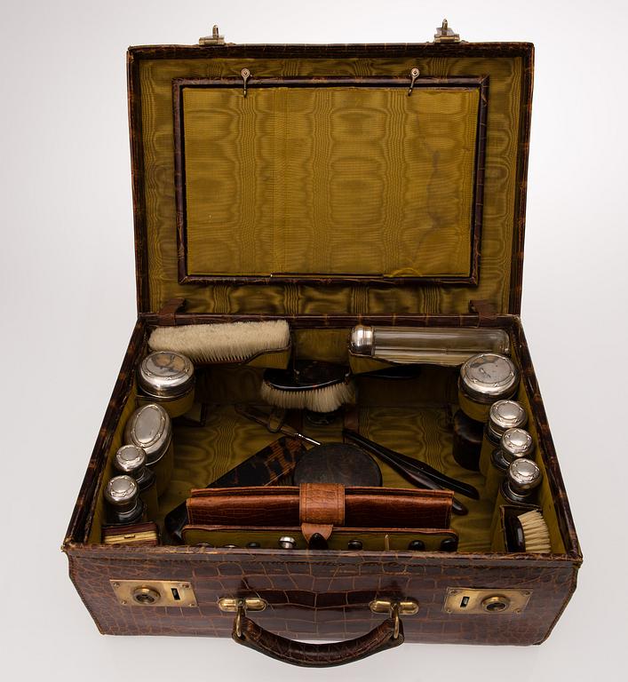 A TRAVEL TOILET CASE, leather, German 1910-20s, boxes with silver lid.