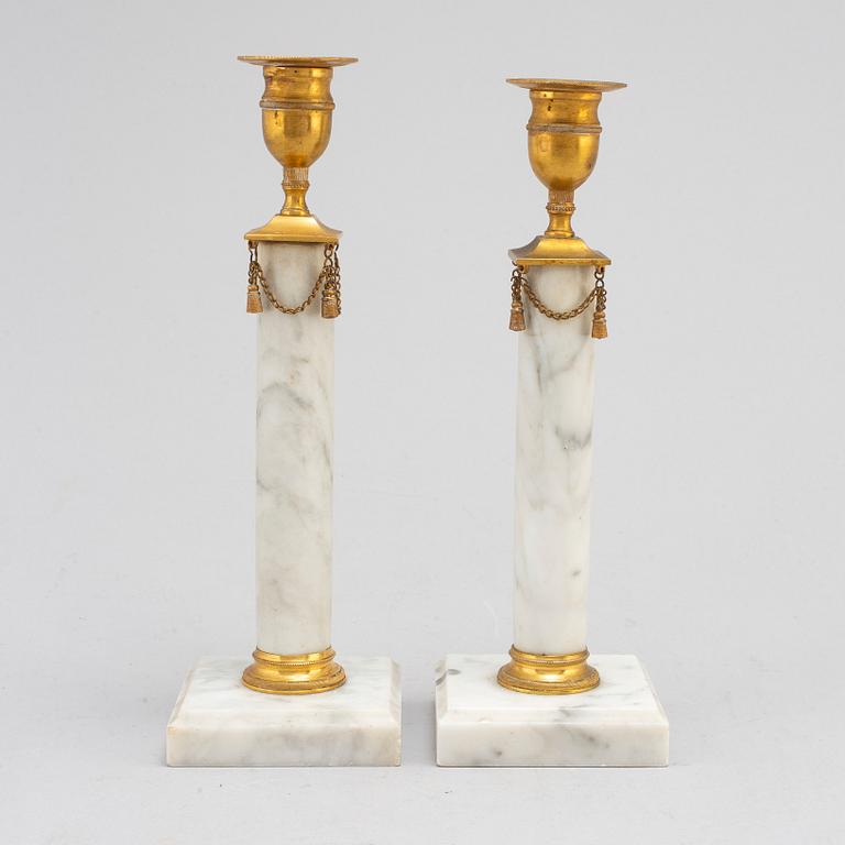 A pair of Gustavians style marble candlesticks, early 20th Century.