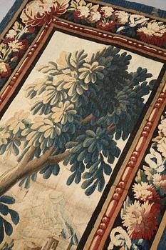 A tapestry, "Verdure", tapestry weave, a so called "entre-fenêtre", ca 295-296 x 126-129,5 cm, signed M.R.DABVSON.i.D.