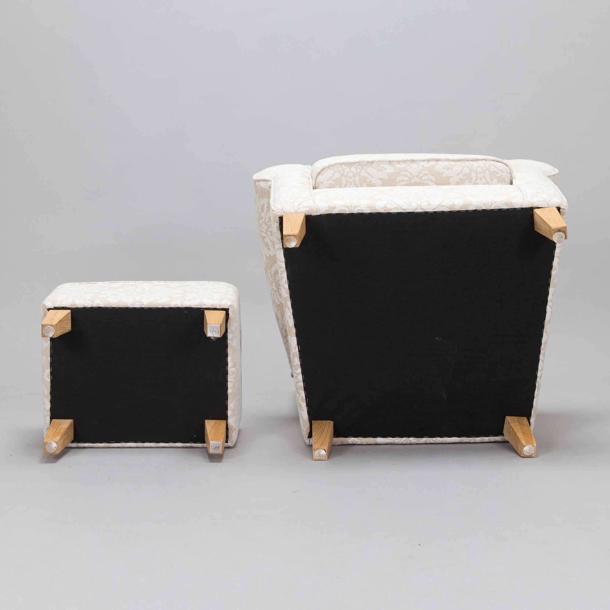 A mid-20th-century armchair and ottoman.