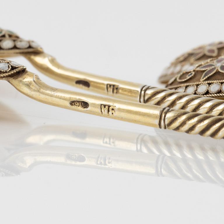 Eight Russian gilded silver and enamel spoons, Moscow, 1896-1908.