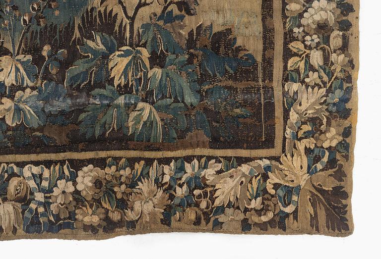 A 17th century Flemish 'verdur' entre-fenêtre tapestry, c. 268 x 130 cm.