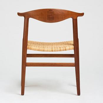 Hans J. Wegner, a teak, oak and cane "Cowhorn chair", JH 505, Johannes Hansen, Denmark 1950-60's.