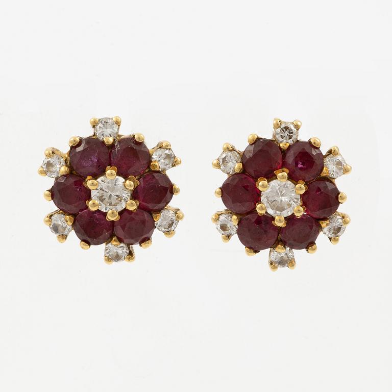 Earrings, a pair, 18K gold with rubies and brilliant-cut diamonds.