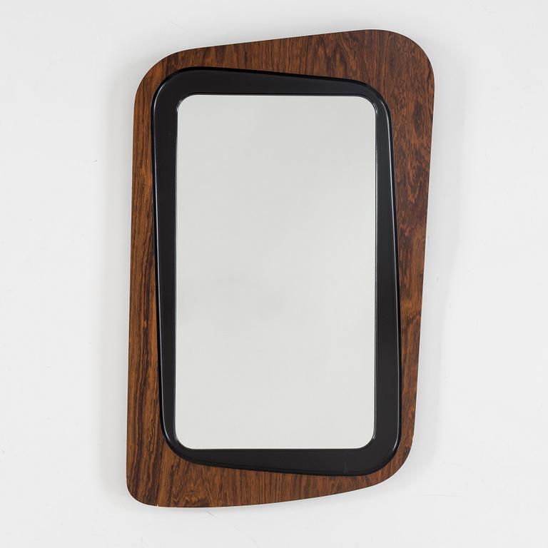 A second half of the 20th century rosewood mirror with table.
