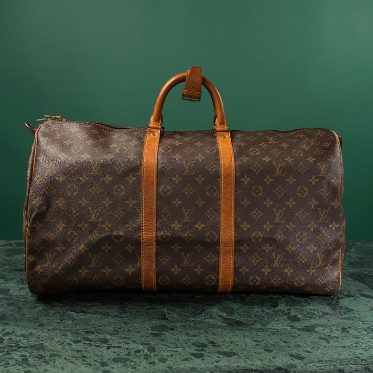 A monogram canvas weekendbag "Keepall 55 Bandoulière " by Louis Vuitton.