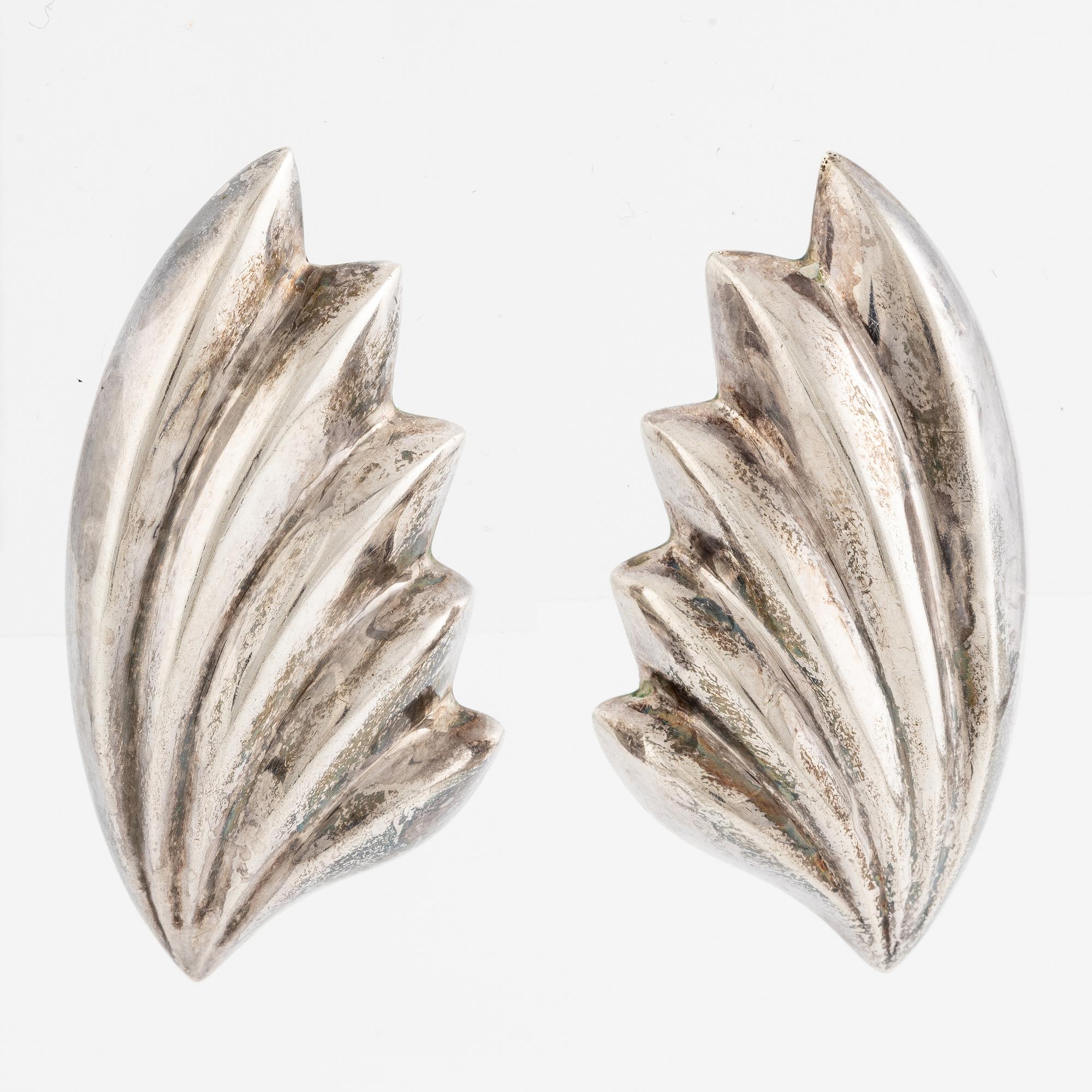 Earrings, silver, in the form of stylised leaves.