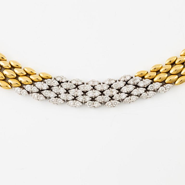 An 18K gold necklace set with round brilliant-cut diamonds.