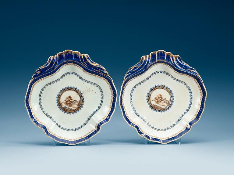 A pair of "European subject" blue and white, and gold dishes, Qing dynasty, Jiaqing (1796-1820).