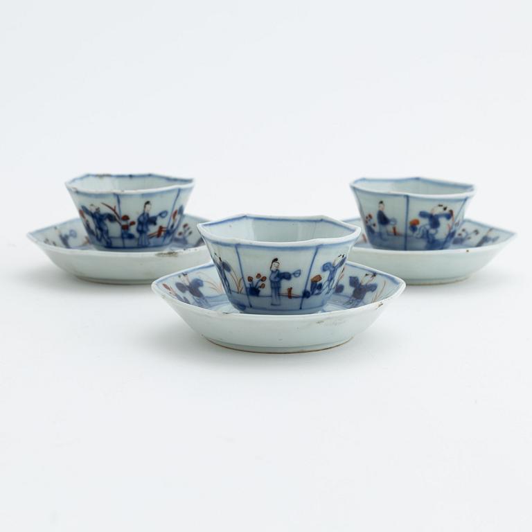 Three Chinese porcelain cups and saucers, Qing dynasty, 18th century.