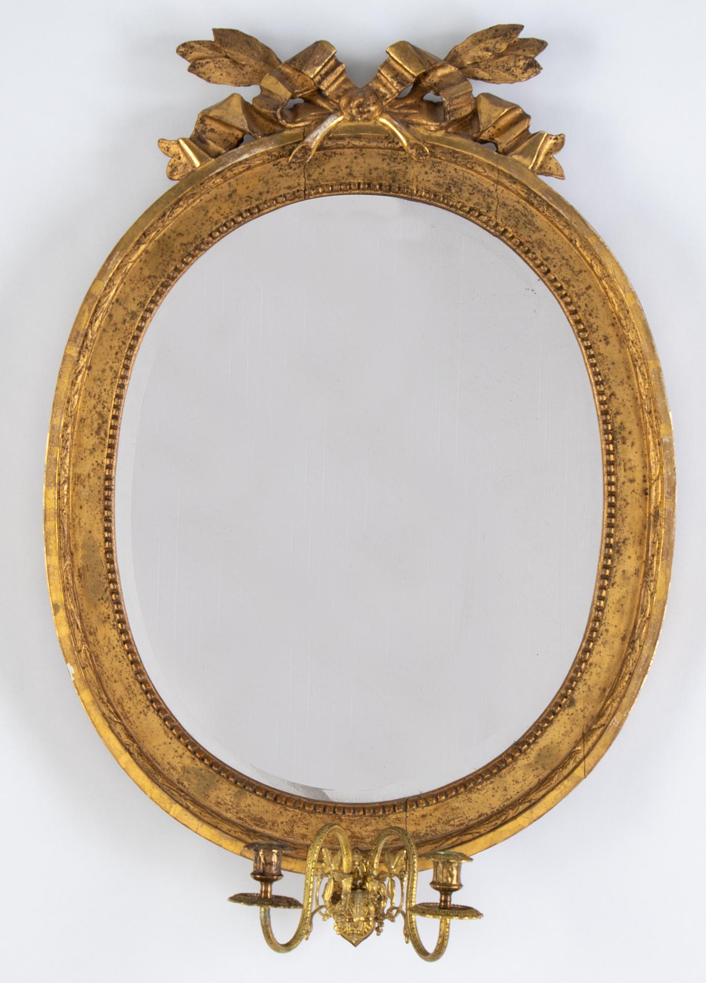 A Gustavian two-light girandole mirror, Stockholm, late 18th century.