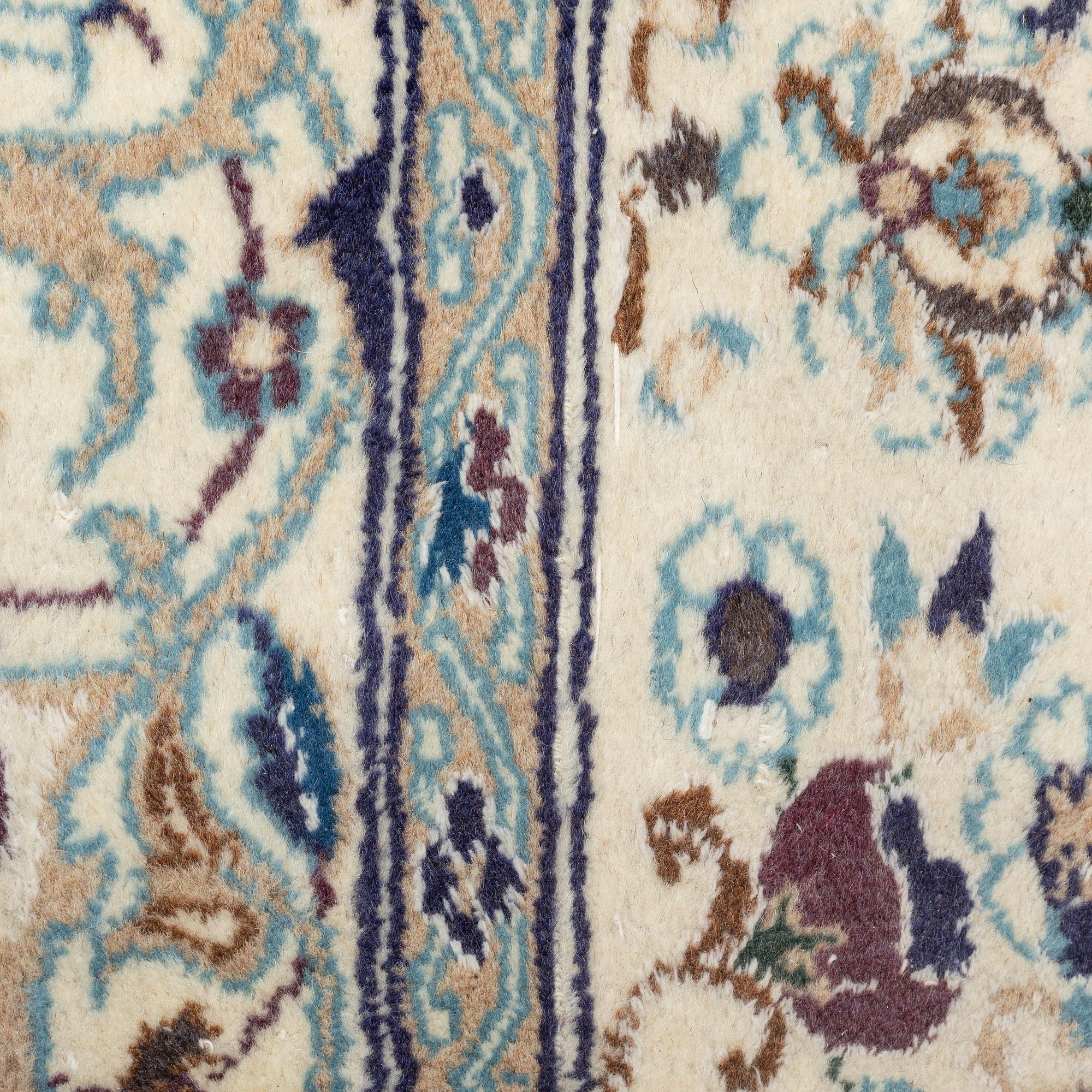 A Nain carpet, circa 310 x 196 cm.
