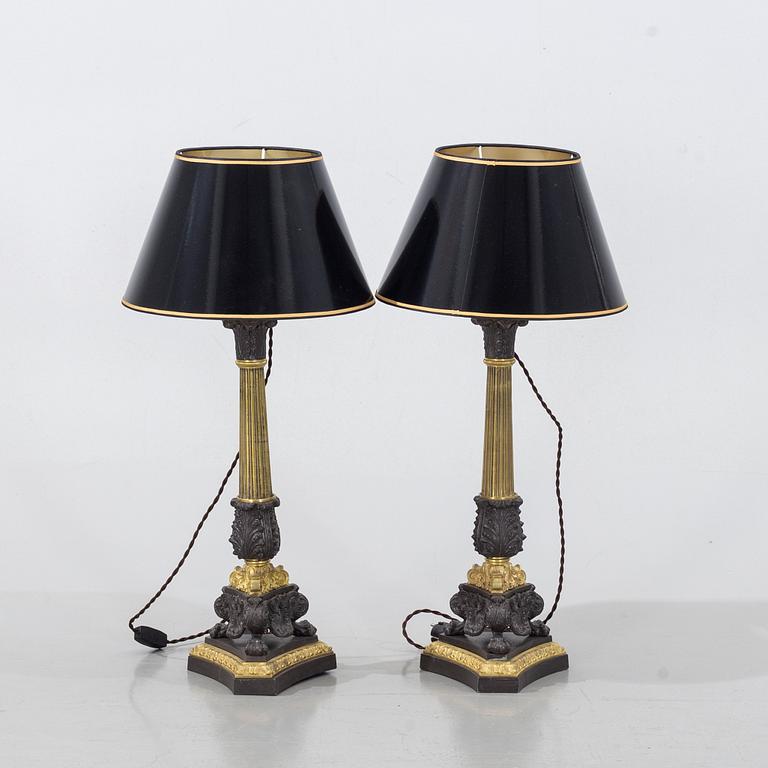 A pair of bronze late 19th/ early 20th century table lamps.