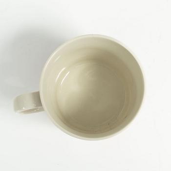 A Moomin mug, 'Dark rosa' with sticker, Arabia, Finland, 1991-99.