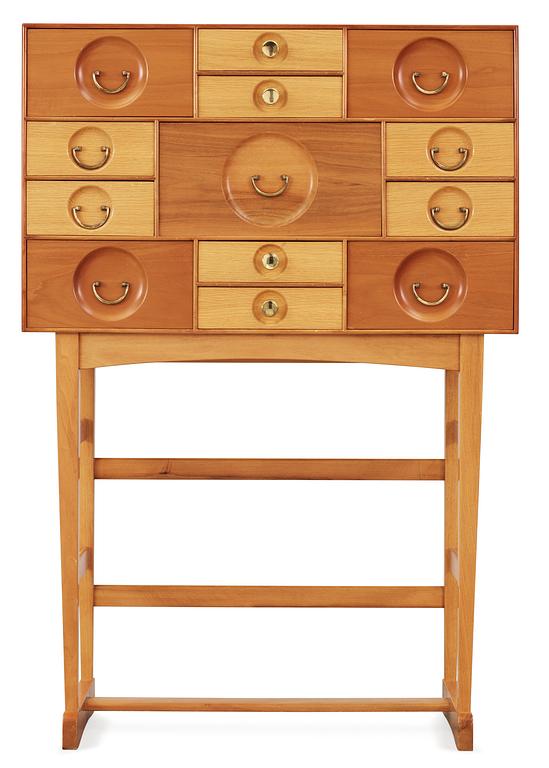 A Josef Frank cabinet on stand with thirteen different size  drawers,