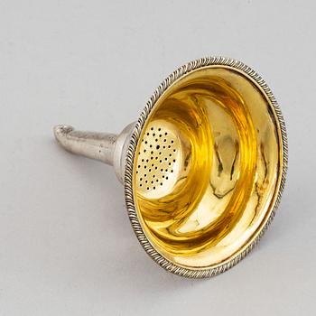 A Swedish 19th century parcel-gilt silver wine-strainer, mark of Adolf Zethelius, Stockholm 1839.