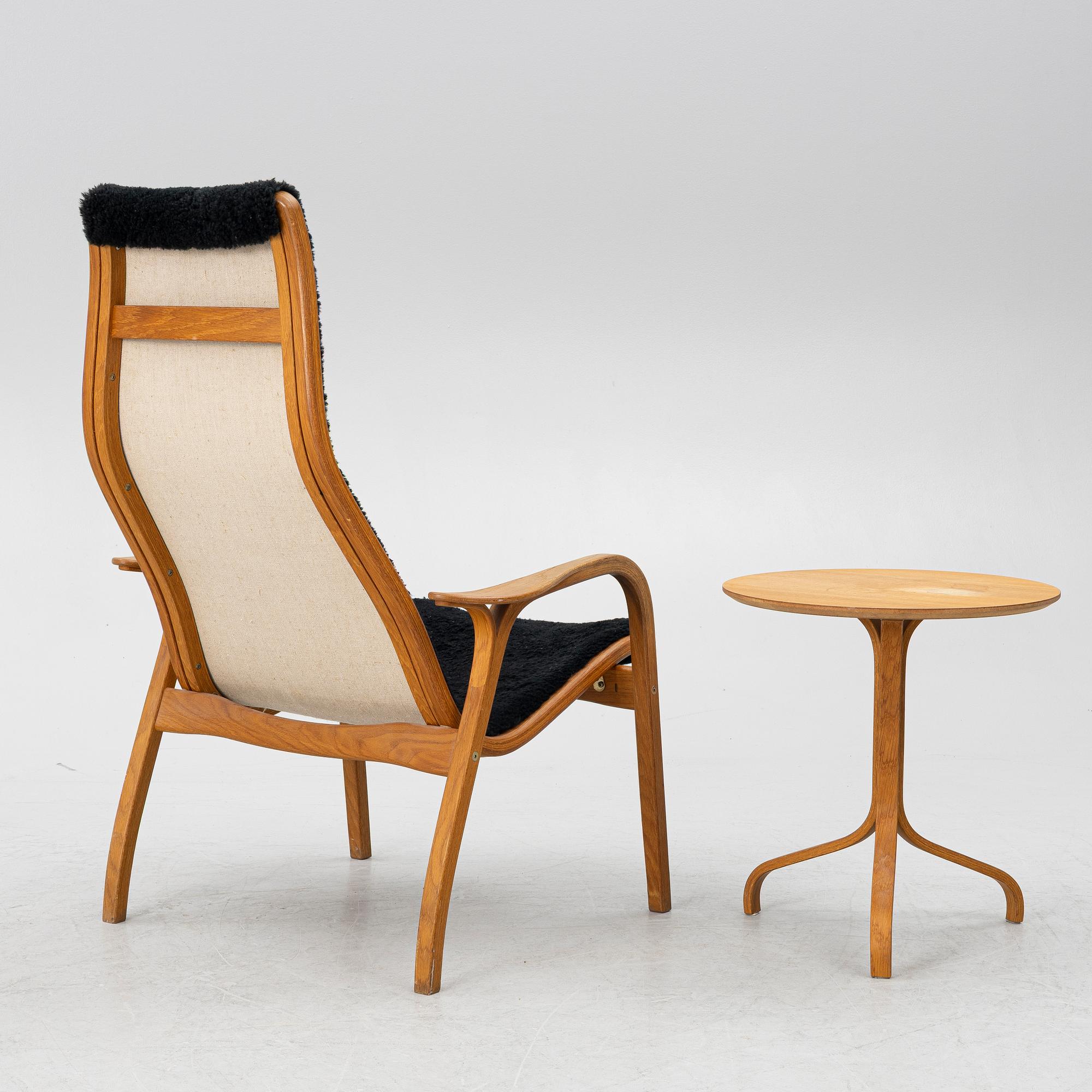 Yngve Ekström, a 'Lamino' armchair and sidetable, Swedese, Sweden, early 21st century.