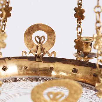 An Empire cut glass and gilded bronze six-light hanging lamp in the manner of Alexandre Guérin.