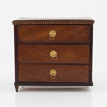 An Empire mahogany miniature commode, 19th Century.