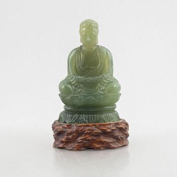 A sculptured bowenite figure of buddha, 20th century.