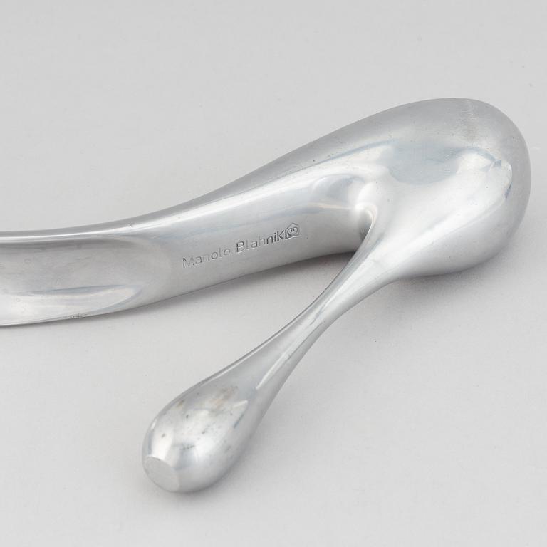 Manolo Blahnik, a metal shoe horn, 21st century.