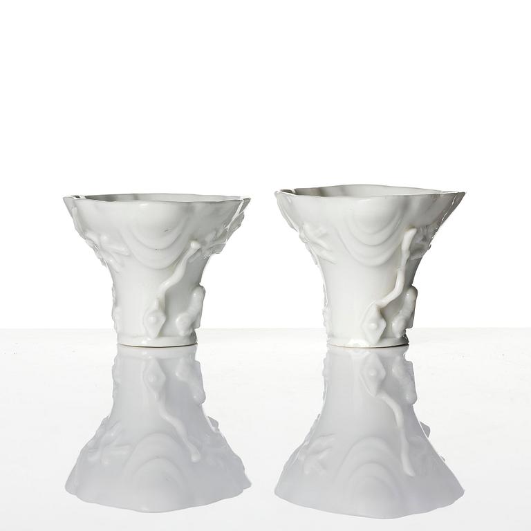 Two blanc de chine rhinoceros libation cups, Qing dynasty, Kangxi (1662-1722).