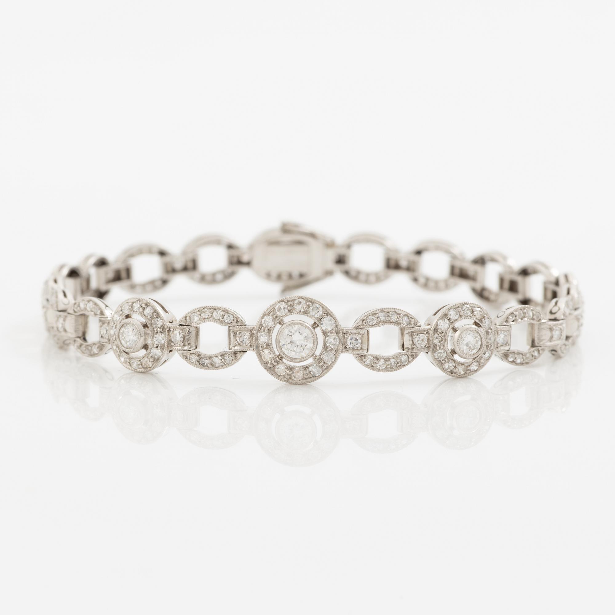 Bracelet in platinum set with round brilliant, octagonal, and rose-cut diamonds.