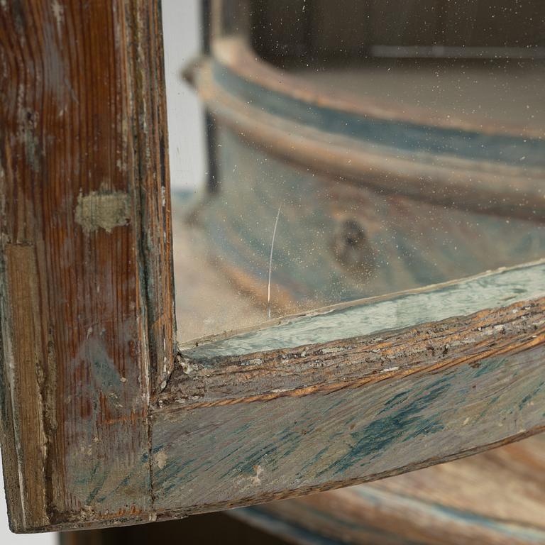 A marbeled corner cabinet, 18th Century.