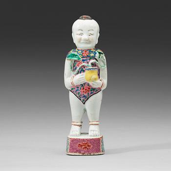 621. A famille rose figure of a boy, Qing dynasty, 18th Century.