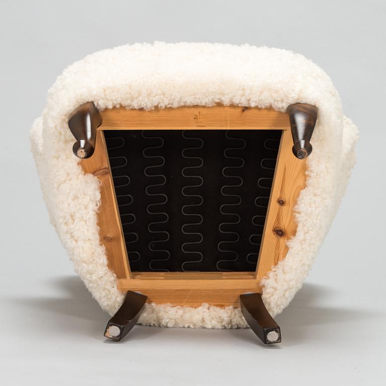 A contemporary sheepskin upholstered lounge chair, ABC collection.