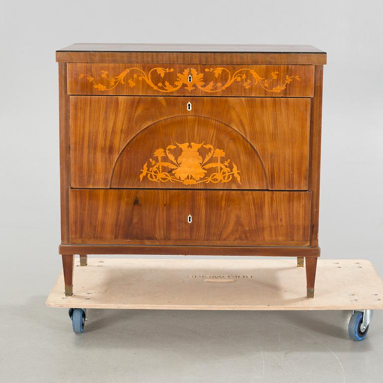 An empire chest of drawers, 19th century.